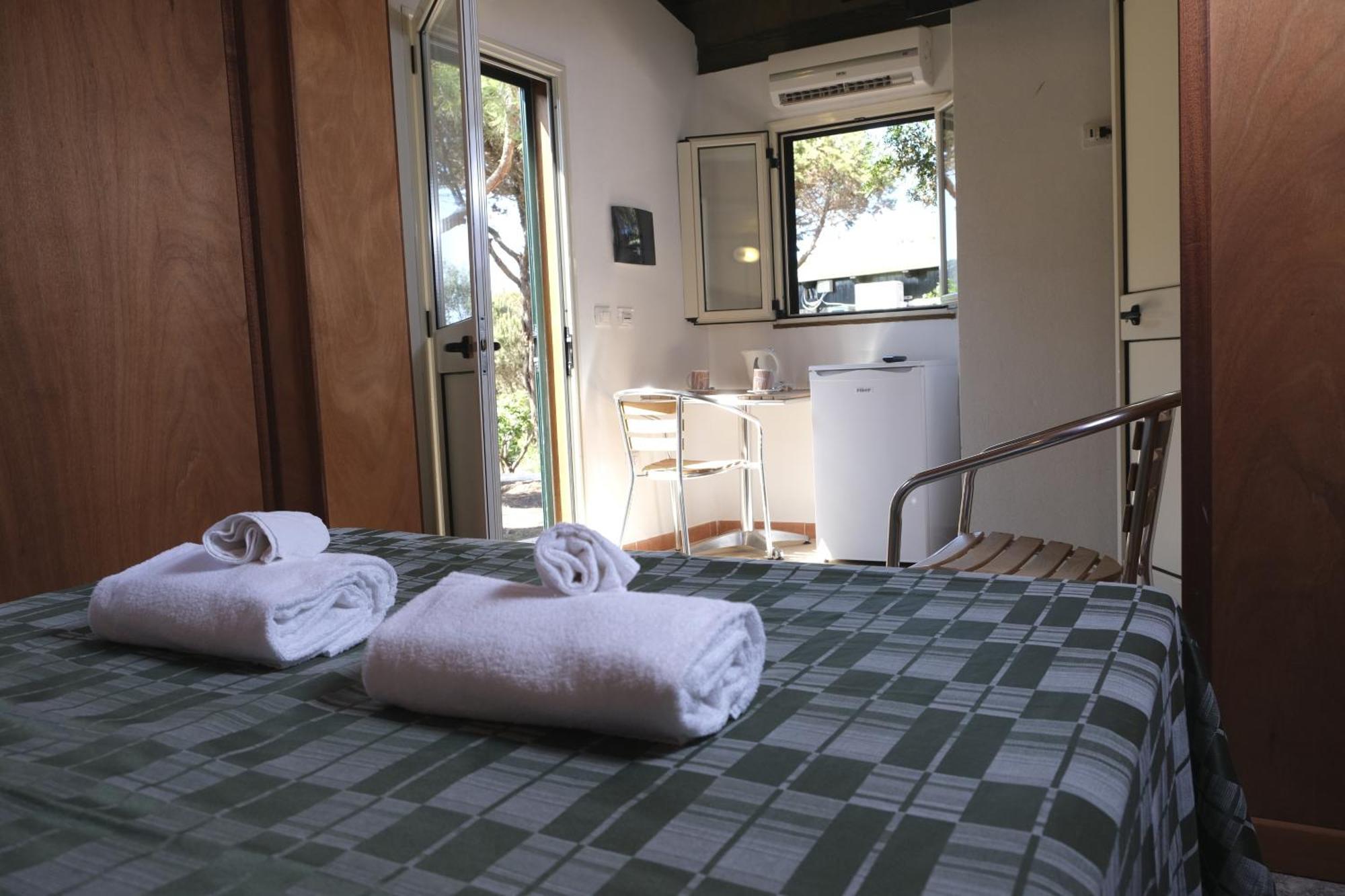 Villaggio Camping Torre Del Porticciolo ปอร์โต คอนเต ห้อง รูปภาพ